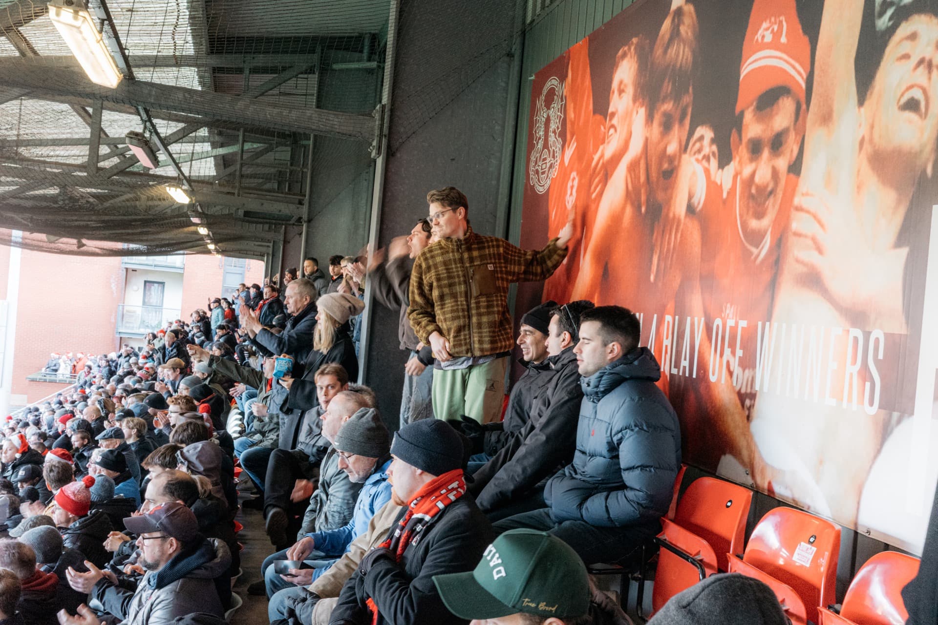 Fans pushing on their team from the stands